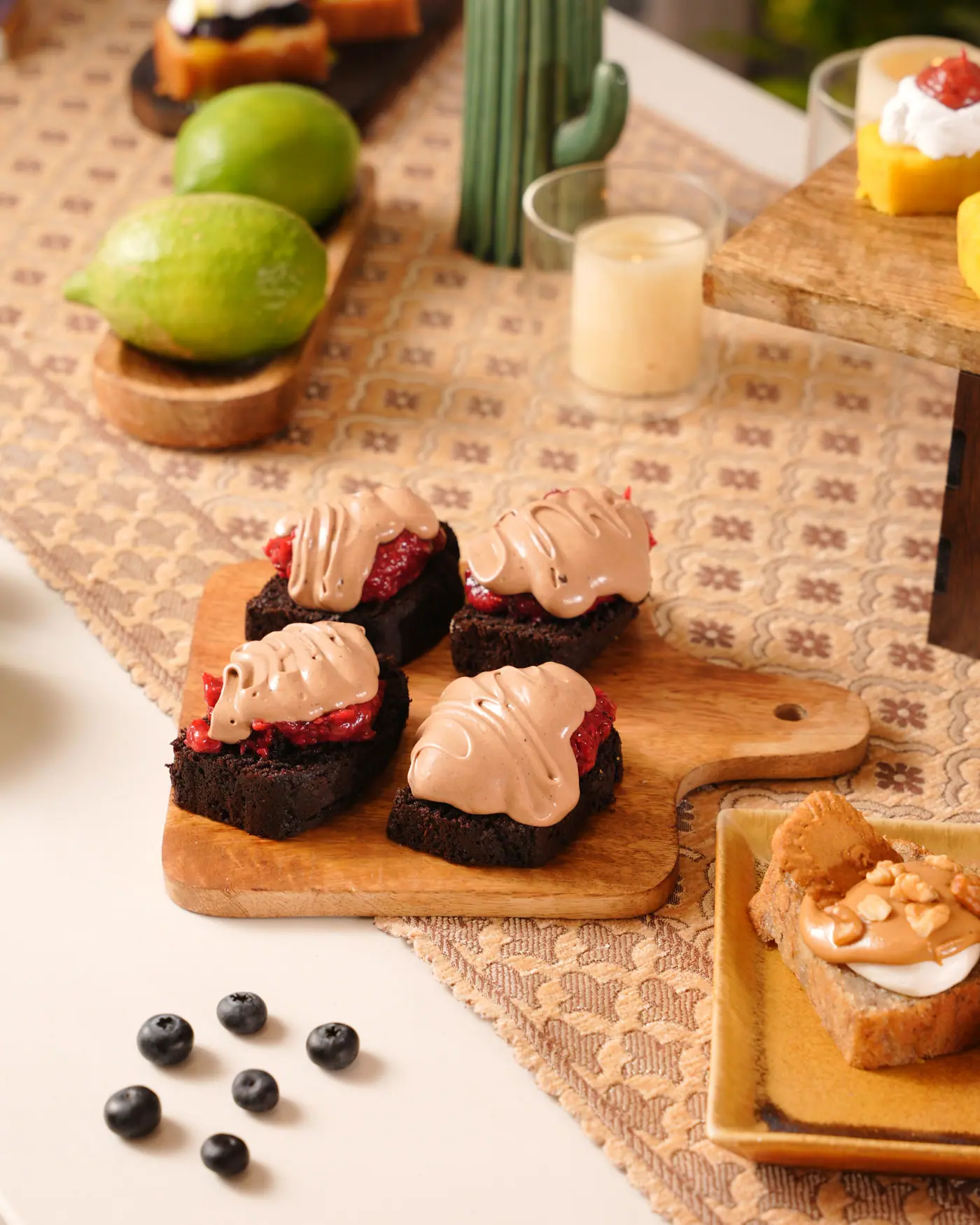 Brownie bites with strawberry and whipped ganache