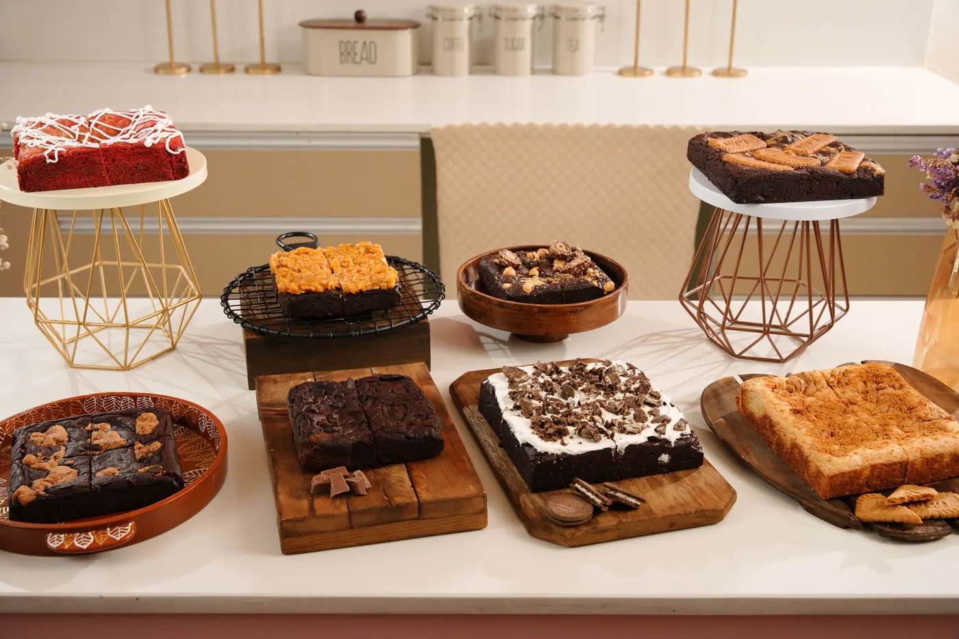 Brownies and blondies laid out on the studio counter