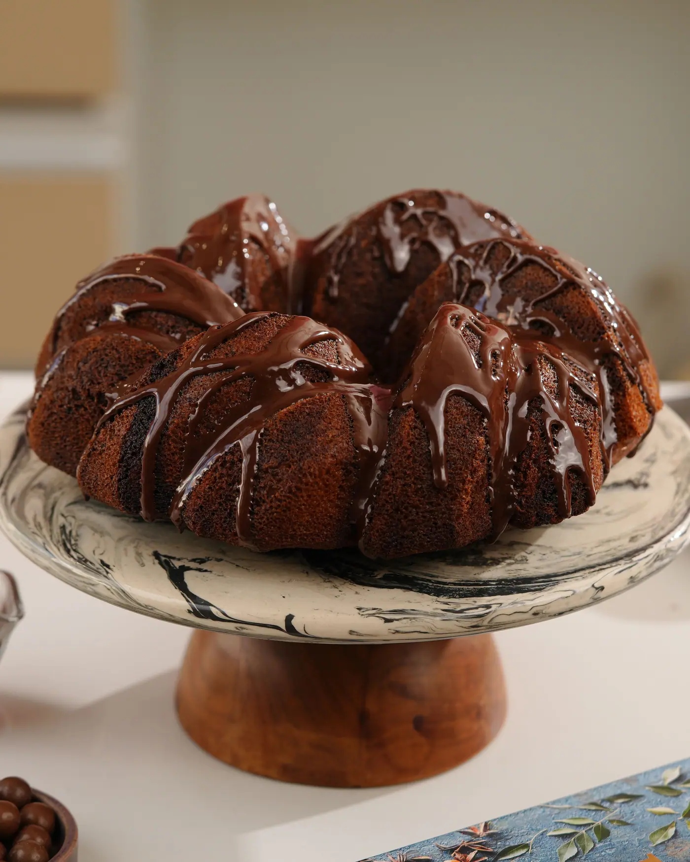 Chocolate-glazed bundt on a stand